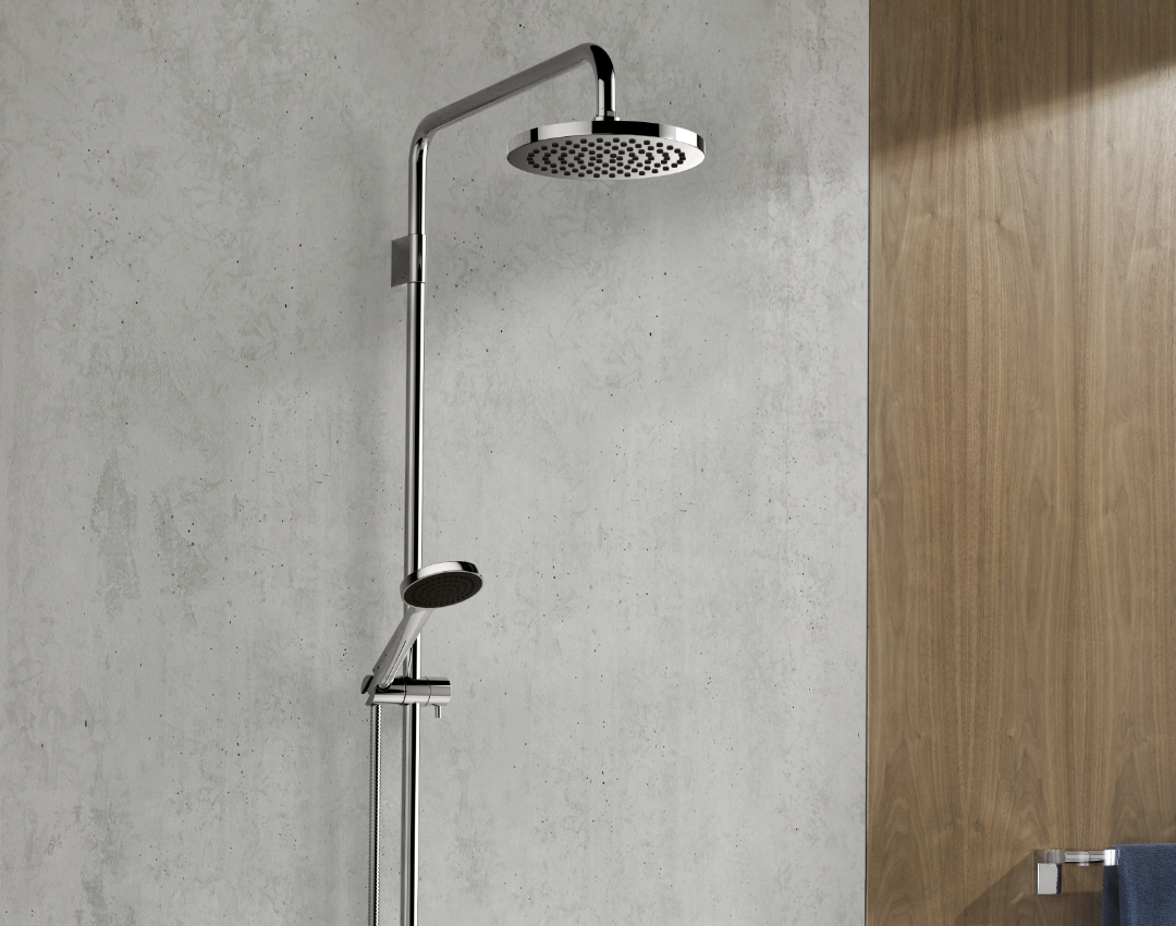 Dornbracht chrome shower system with a large round rain shower head and adjustable hand shower, mounted on a concrete-effect bathroom wall next to oak wood paneling.