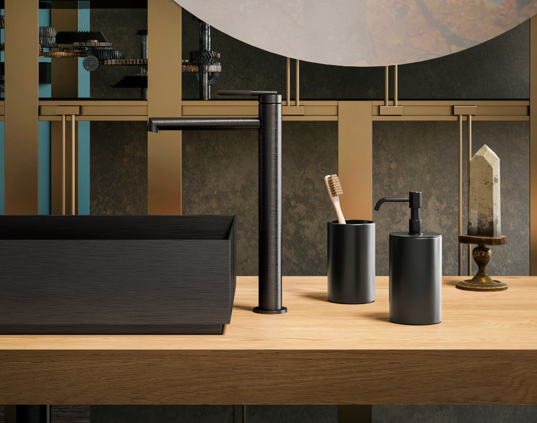 Gessi brushed black tall mono basin mixer and designer dark countertop washbasin. Industrial luxury bathroom design featuring timber vanity surfaces and architectural brass accents.