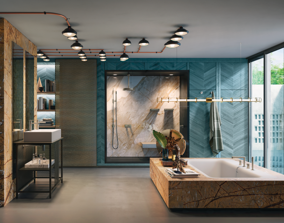 Gessi luxury bathroom suite featuring designer brassware in a contemporary open-plan setting. Industrial-chic vanity with Gessi basin tap, orange marble bathtub, and teal chevron wall panels.