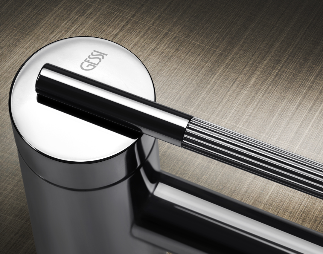 Gessi luxury chrome basin mixer tap with knurled handle detail. Premium Italian bathroom brassware showcasing high-quality industrial design and polished finish.