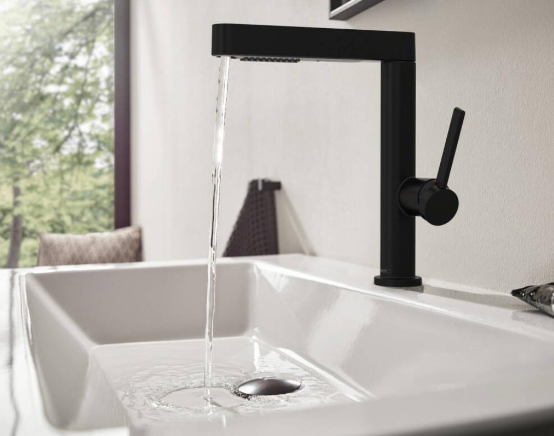 Hansgrohe Finoris matte black tall mono basin mixer tap with pull-out spray. Modern deck-mounted tap for countertop washbasins in a minimalist bathroom design.