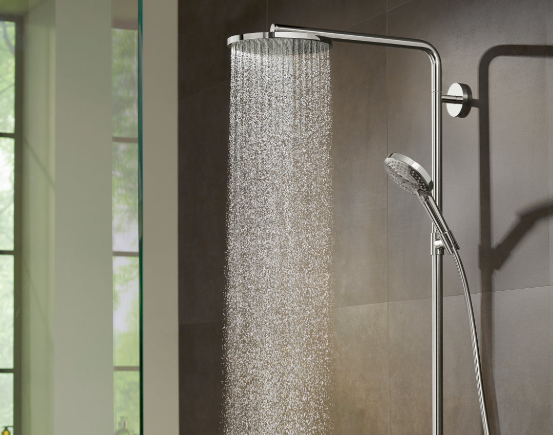Luxury chrome thermostatic hansgrohe rainfall shower system with dual heads installed in a contemporary walk-in shower.