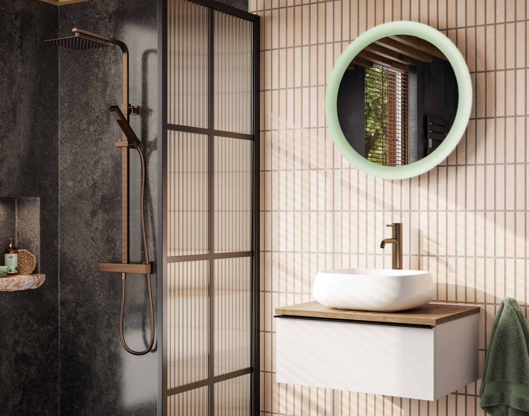 HiB illuminated round bathroom mirror with LED halo lighting, brushed bronze shower fittings, and fluted glass shower screen