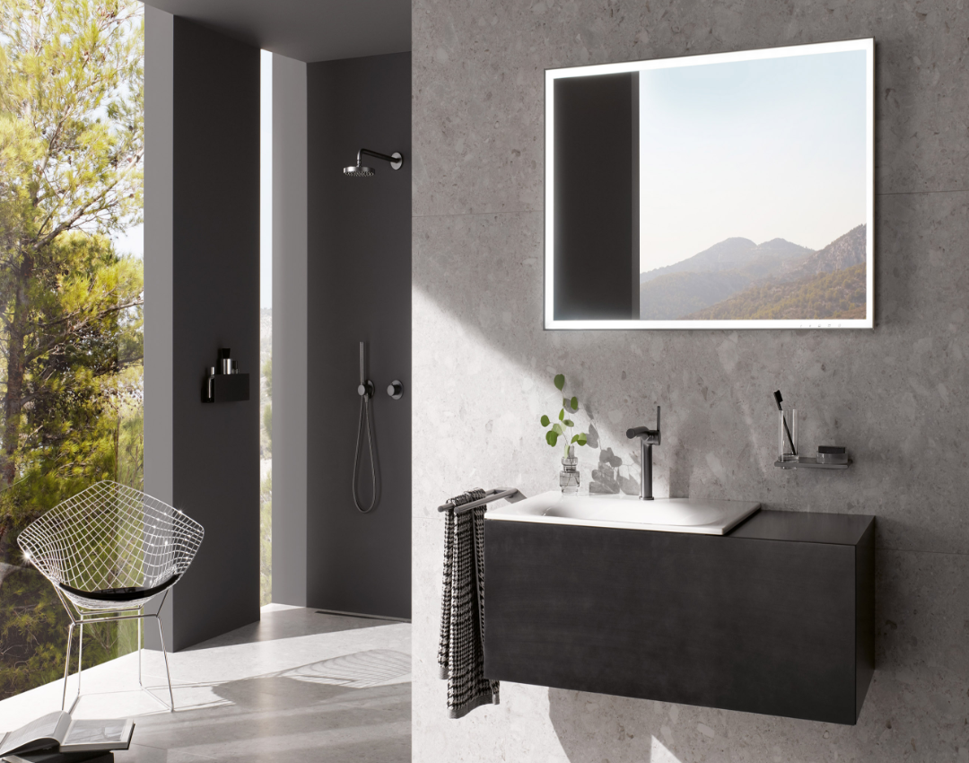 Keuco Edition 400 modern bathroom suite featuring a black matte vanity unit, illuminated LED mirror, and matching black basin mixer and shower fittings.