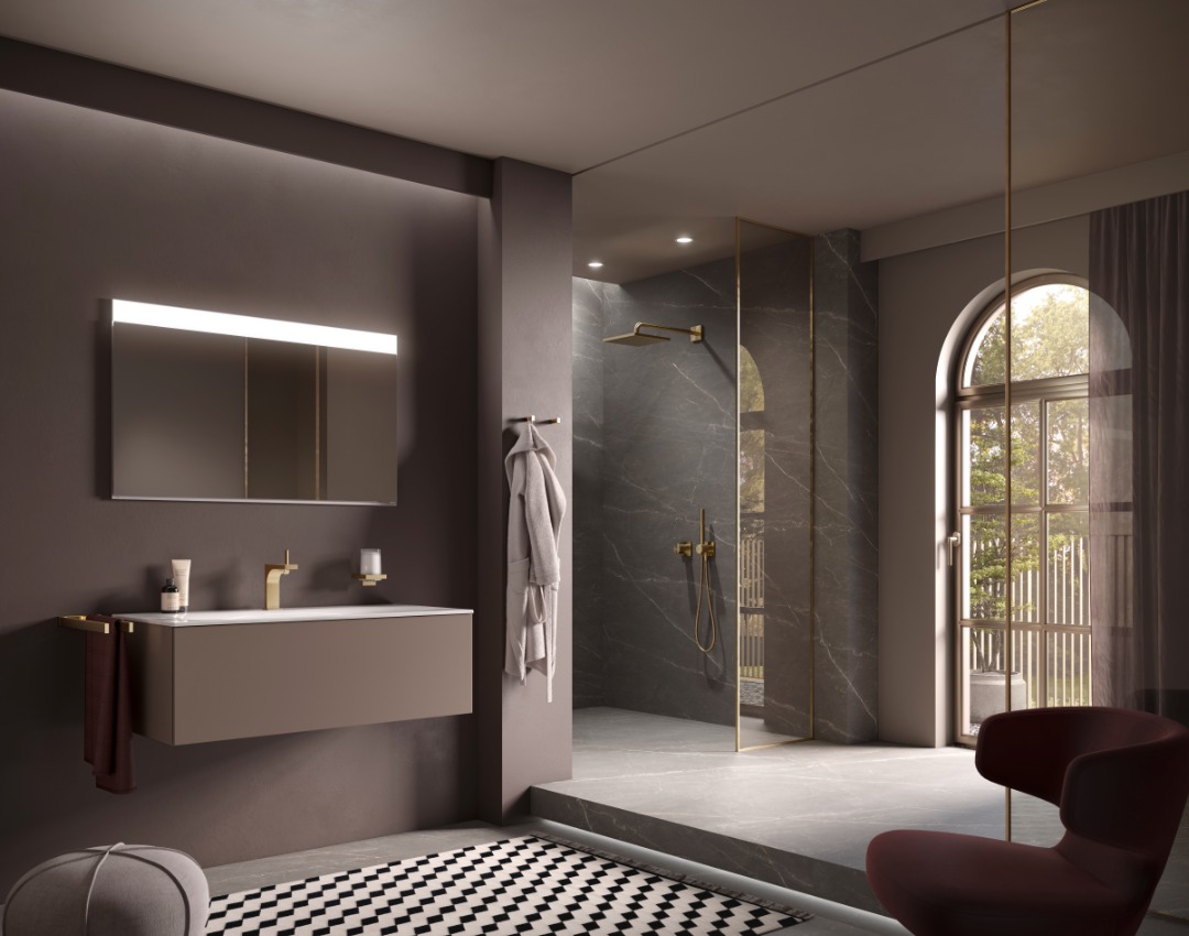 Luxury bathroom suite featuring KEUCO Edition 400 furniture and brassware. Includes a wall-hung truffle finish vanity unit, gold washbasin mixer, and a matching gold thermostatic rainfall shower set against dark marble walls.
