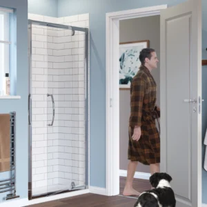 Bathroom scene with a pivot door shower, man in robe, and dog.